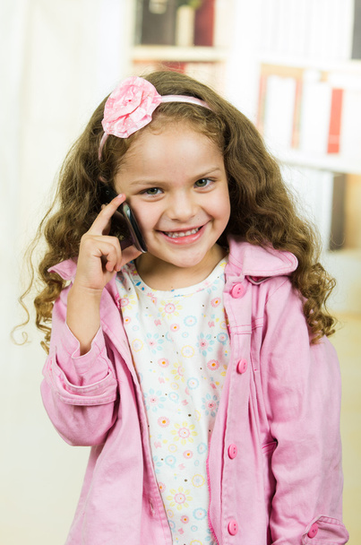 cute little girl using cell phone - Фото, зображення