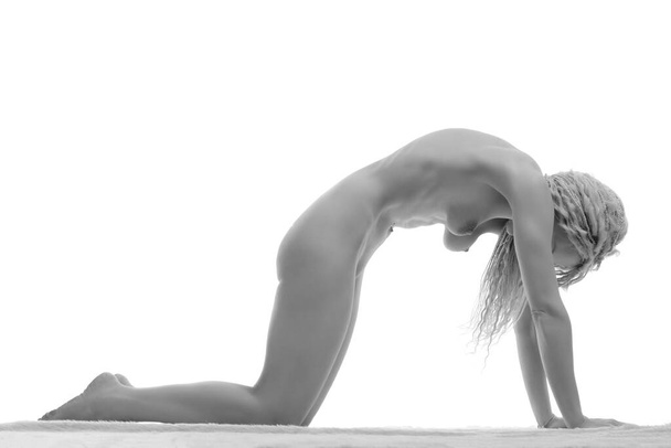 young woman naked yoga on white background - Foto, Imagen