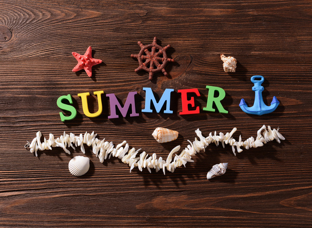 Word summer on wooden background - Foto, Bild