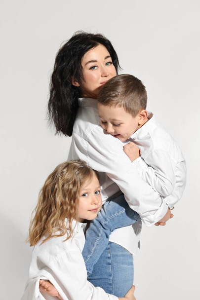 Little children with their mother on white background - Zdjęcie, obraz