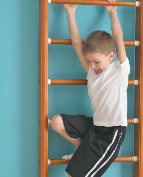boy jumps off the ladder - 写真・画像