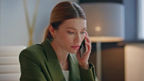 Emotional businesswoman answering call speaking mobile phone at cabinet closeup. Angry nervous manager discussing project gesturing hands at modern space. Annoyed ceo in formal suit working at office - Footage, Video