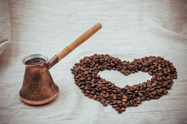 Coffee turk and roasted beans on burlap background. - Foto, imagen