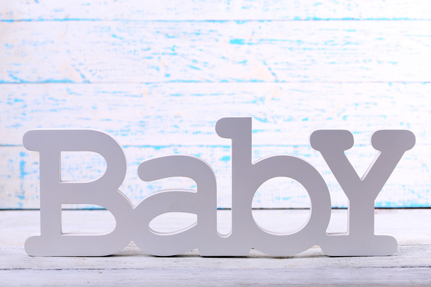 Word baby on wooden background - Φωτογραφία, εικόνα
