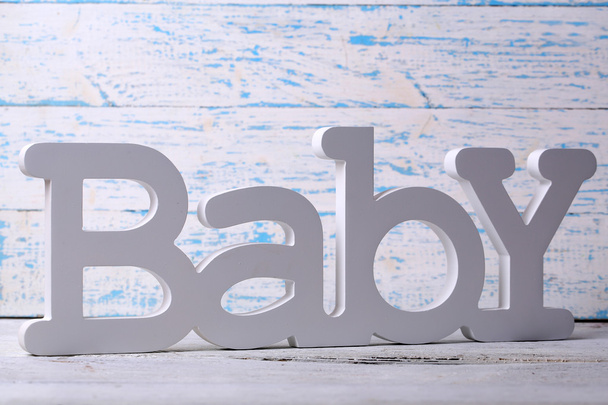 Word baby on wooden background - 写真・画像