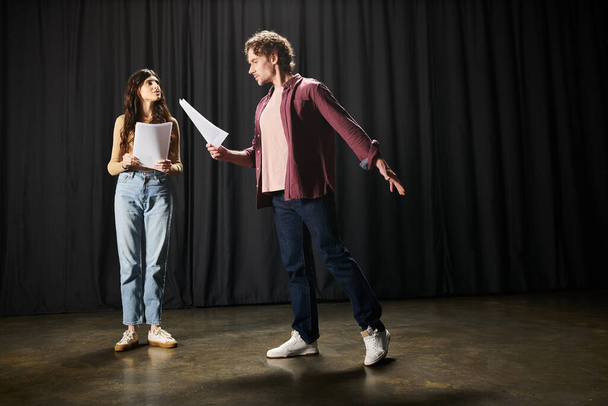A man and woman practicing lines together, holding a paper. - Photo, Image