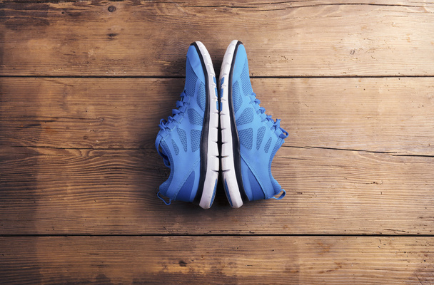 Running shoes on the floor - Foto, Imagen