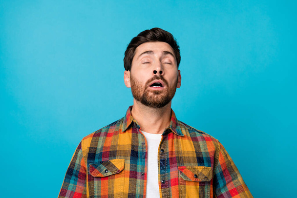 Photo portrait of handsome young male sneeze suffer allergy wear trendy plaid outfit isolated on blue color background. - Fotografie, Obrázek