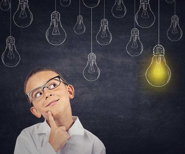 Big idea. Smart boy with solution lightbulb above head - Fotografie, Obrázek