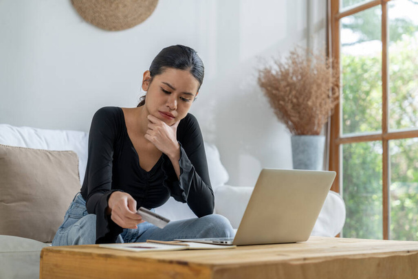 Stressed young woman has financial problems with credit card debt to pay uttermost show concept of bad personal money and mortgage pay management crisis. - Photo, Image