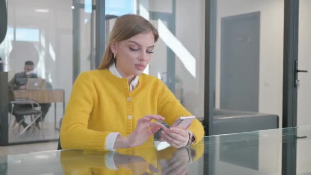 Young Woman Excited for Online Trading Success on Phone - Footage, Video