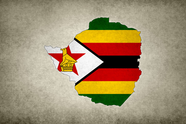 Grunge map Zimbabwe z flagą wydrukowaną w jego granicach na starym papierze. - Zdjęcie, obraz