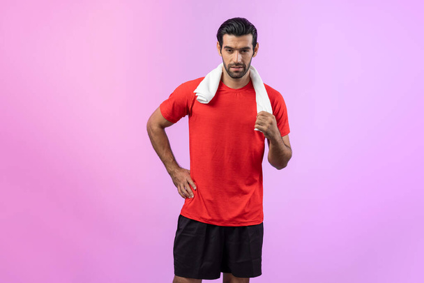 Full body length gaiety shot athletic and sporty young man in fitness exercise posture on isolated background. Healthy active and body care lifestyle. - Photo, Image