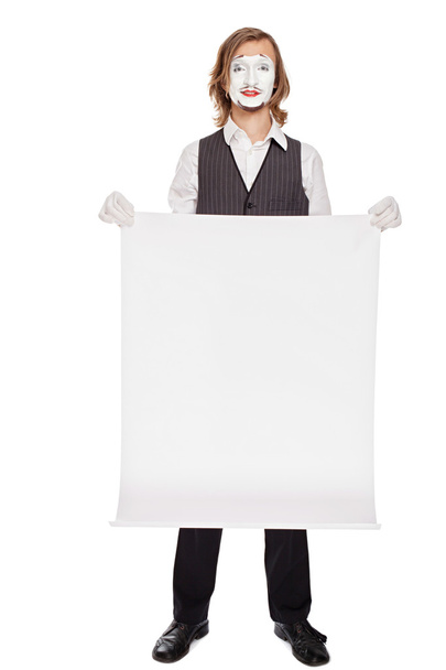 mime actor shows a white sheet - Foto, afbeelding