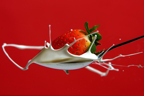 Strawberry in milk splash - Photo, Image