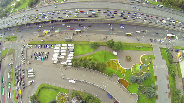 Parking lot near estacade with traffic - Footage, Video