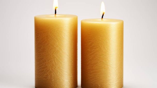 Stylish elegant gold candles on white background - Photo, Image
