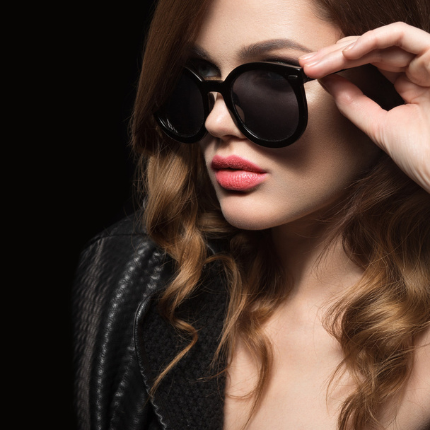 Beautiful girl in dark sunglasses, with curls and evening makeup. Beauty face. - Foto, imagen
