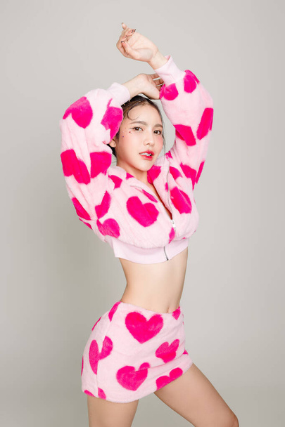 Young Pretty Asian woman have prefect slim fit body in heart print dress with makeup on face isolated on white background. Valentine, love, plastic surgery concept. - Fotó, kép