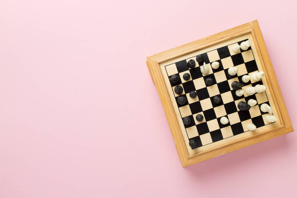 Wooden chess on color background, top view - Photo, Image