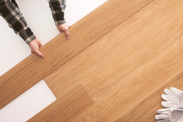 Wooden flooring installation at home - Фото, изображение