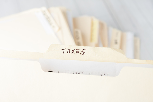 sárga könyv dosszié címkével ellátott adók - Fotó, kép