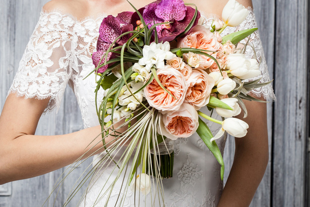 Beautiful wedding bouquet in hands of the bride  - 写真・画像