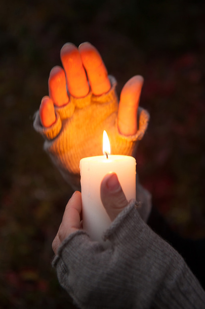 Praying Hands with candle in dark background - Photo, Image