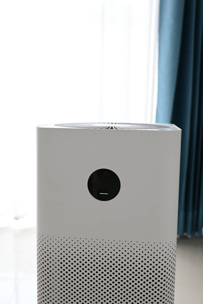 air purifier technology clean dust pm 2.5 in living room inside home for healthy care of respiratory system - Photo, Image