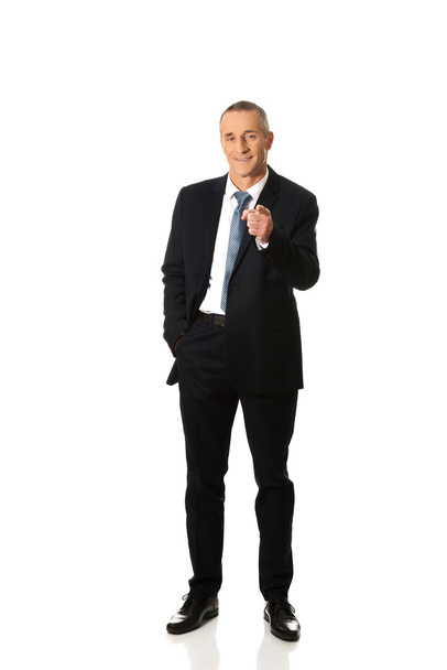 Full length businessman pointing on you - Foto, afbeelding