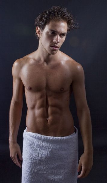 Handsome young man with towel around waist - Photo, Image