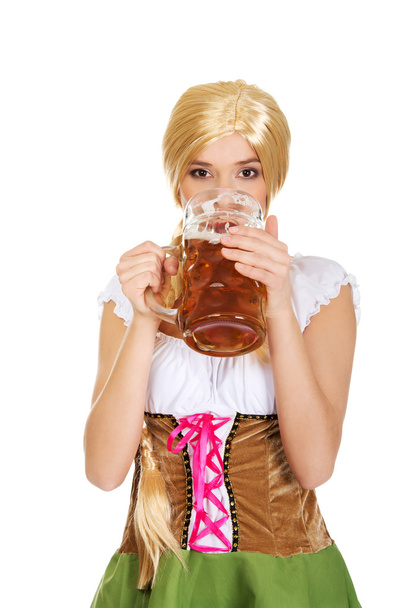 Bavarian woman drinking beer. - Fotoğraf, Görsel