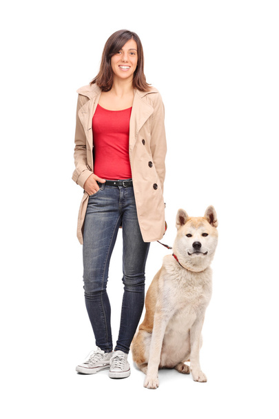 Young girl posing with dog - Fotó, kép
