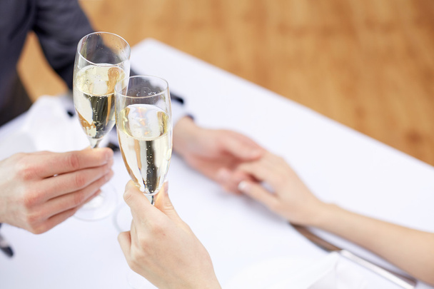 couple with glasses of champagne at restaurant - Photo, Image