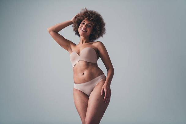 Unretouched photo of body positive girl with belly curves self accept isolated over pastel color background. - Фото, изображение