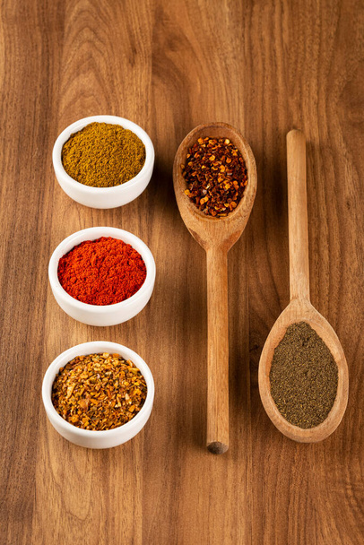 Variety of spices and seasonings on the table. - Photo, Image