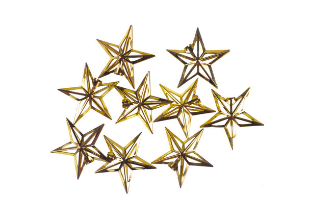 декоративные золотые праздничные звезды на белом фоне - Фото, изображение