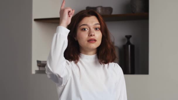 Close-up female portrait young caucasian woman showing prohibition sign crossing arms making refusal gesture negative shaking head dissatisfied serious girl says no refuses demonstrates stop gesture - Filmagem, Vídeo