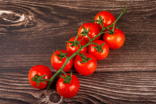 Ripe tomatoes on the wooden table. - Photo, Image