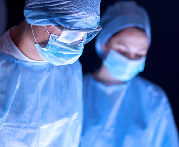 Team surgeon at work in operating room. - Фото, зображення