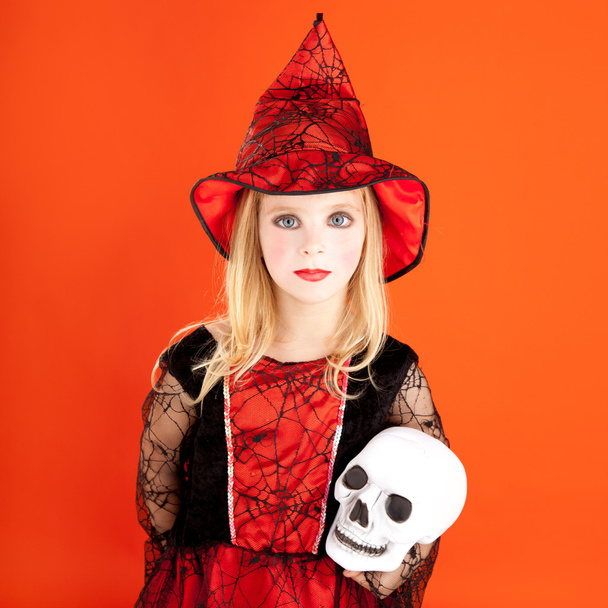 Halloween kid girl costume on orange - Fotó, kép