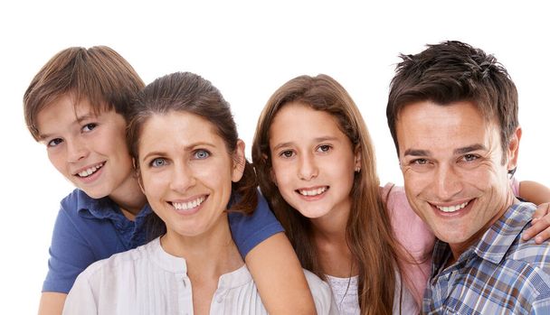 Happy family, portrait and hug with kids for embrace, bonding or support on a white studio background. Face of mother, father and children with smile for love, care or trust on holiday or weekend. - Photo, Image