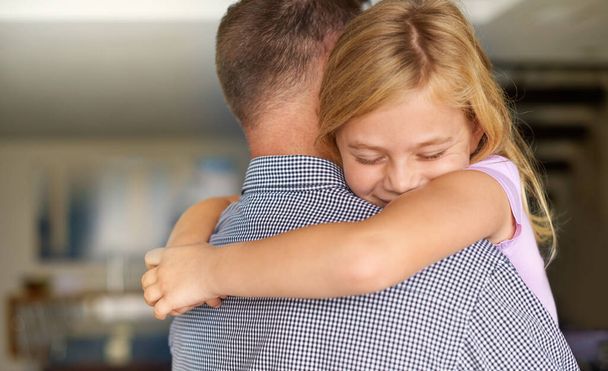 Hug, man and child with love for happiness, bonding and care at house, living room or apartment in reunion together. Family, father and loving kid embracing dad, parent and comfort with support. - Photo, Image