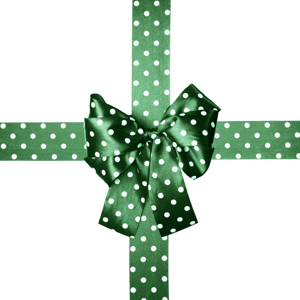 зелений лук і стрічка з білими крапками полоки з шовку
 - Фото, зображення