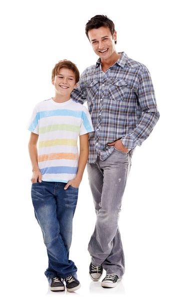 Happy father, portrait and hug with kid in fashion for family or bonding on a white studio background. Dad, son or child with smile in casual clothing, support or trust for parenthood or childhood. - Photo, Image