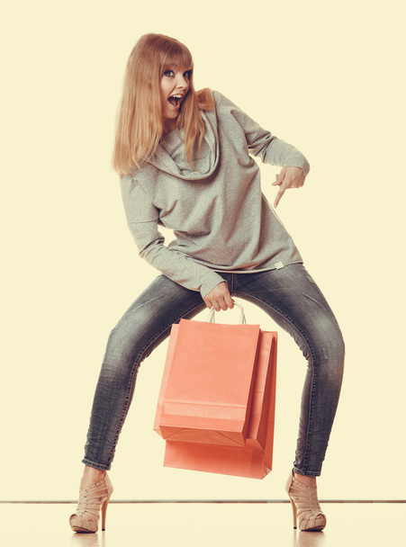 Girl holding  red shopping bags - Valokuva, kuva