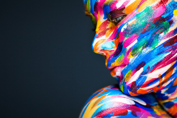 Portrait of the bright beautiful girl with art colorful make-up and bodyart - 写真・画像