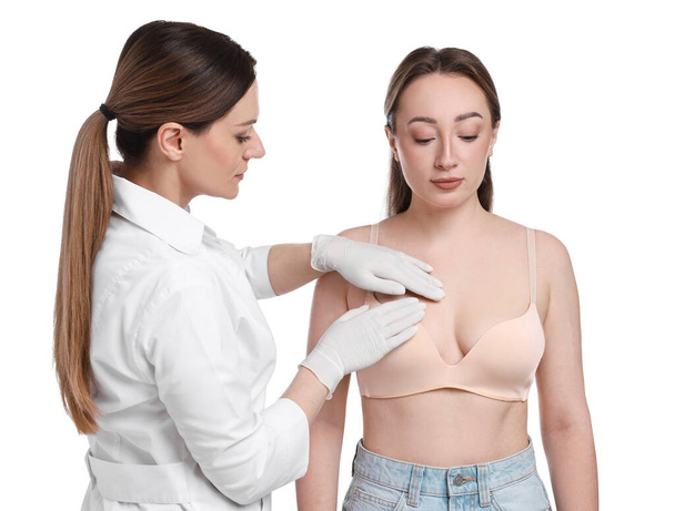Mammologist checking woman's breast on white background - Foto, imagen