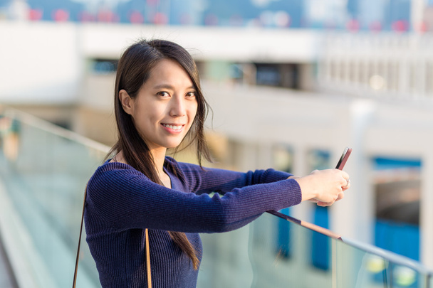 Woman using smartphone at outdoor - Photo, Image