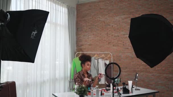 Woman influencer shoot live streaming vlog video review makeup crucial social media or blog. Happy young girl with cosmetics studio lighting for marketing recording session broadcasting online. - Footage, Video